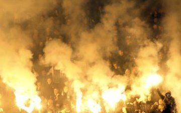 Partizan soccer fans light torches during a Serbian National soccer league derby match between Partizan and Red Star, in Belgrade, Serbia, Saturday, Feb. 27, 2016. Red Star won 1-2. (AP Photo/Darko Vojinovic)