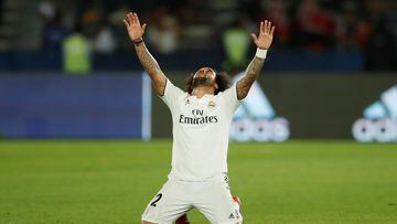Soccer Football - Club World Cup - Final - Real Madrid v Al Ain - Zayed Sports City Stadium, Abu Dhabi, United Arab Emirates - December 22, 2018  Real Madrid's Marcelo celebrates after winning Club World Cup  REUTERS/Andrew Boyers