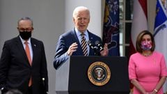 US President Joe Biden, with (L-R) Senate Majority Leader Chuck Schumer, Democrat of New York, and House Speaker Nancy Pelosi, Democrat of California, speaks about the American Rescue Plan in the Rose Garden of the White  House in Washington, DC, on March