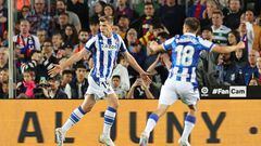 Real Sociedad's Norwegian forward Alexander Sorloth (L) celebrates after scoring his team's second goal during the Spanish league football match between FC Barcelona and Real Sociedad at the Camp Nou stadium in Barcelona on May 20, 2023. (Photo by Lluis GENE / AFP)