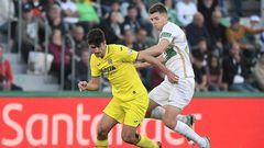 Villarreal's Spanish forward Gerard Moreno (L) fights for the ball with Elche's Spanish midfielder Gerard Gumbau during the Spanish league football match between Elche CF and Villarreal CF at the Martinez Valero stadium in Elche, on February 4, 2023. (Photo by Jose Jordan / AFP)