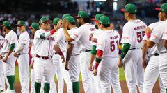 PHOENIX, AZ - MARCH 11: Luis Urías #3 of Team Mexico is greeted by teammates during player introductions prior to Game 1 of Pool C between Team Colombia and Team Mexico at Chase Field on Saturday, March 11, 2023 in Phoenix, Arizona. (Photo by Daniel Shirey/WBCI/MLB Photos via Getty Images)