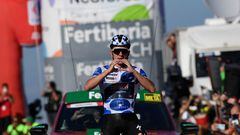 Team Quick Step's Belgian rider Remco Evenepoel celebrates winning the stage 18 of the 2023 La Vuelta cycling tour of Spain, a 178,9 km race between Pola de Allande and Puerto de La Cruz de Linares on September 14, 2023. (Photo by MIGUEL RIOPA / AFP)