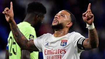 Lyon&#039;s Dutch forward Memphis Depay celebrates after scoring a goa during the French L1 footall match between Olympique Lyonnais (OL) and Dijon FC on August 28, 2020, at the Groupama Stadium in Decines-Charpieu, near Lyon, central-eastern France. (Pho