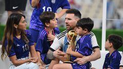 Argentina's forward #10 Lionel Messi holds his Golden Ball award as he celebrates with his wife Antonela Roccuzzo and their sons after the awards ceremony after winning the Qatar 2022 World Cup football final match between Argentina and France at Lusail Stadium in Lusail, north of Doha on December 18, 2022. - Argentina won in the penalty shoot-out. (Photo by FRANCK FIFE / AFP)