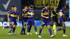 Players of Boca Juniors celebrate after defeating River Plate in the penalty shoot-out after tying 1-1 in their Argentine Professional Football League quarter-final match at La Bombonera stadium in Buenos Aires, on May 16, 2021. (Photo by Daniel Jayo / POOL / AFP)