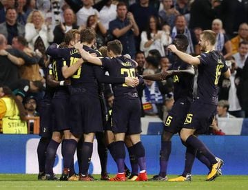 Spurs celebrate after taking a first-half lead in Madrid.
