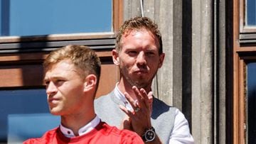 15 May 2022, Bavaria, Munich: Joshua Kimmich (l) and coach Julian Nagelsmann of FC Bayern München celebrate the German soccer championship on the balcony of the city hall at Marienplatz. FC Bayern München has won the German Bundesliga soccer championship for the tenth time in a row. Photo: Matthias Balk/dpa (Photo by Matthias Balk/picture alliance via Getty Images)