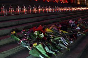 Flowers are laid and candles are lit on the steps of St Georges Hall in remembrance of the 96 Liverpool fans who died in the Hillsborough football stadium disaster.