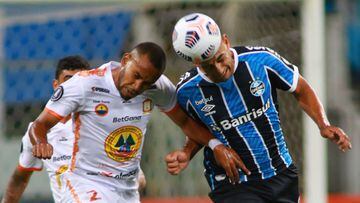 Porto Alegre (Brazil), 10/03/2021.- Diego Souza (R) of Gremio vies for the ball with Hector Salazar (L) of Ayacucho during the Copa Libertadores soccer match between Gremio and Ayacucho FC at Arena do Gremio stadium in Portoa Aegre, Brazil, 10 March 2021.