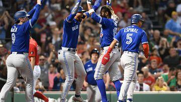 BOSTON, MASSACHUSETTS - JULY 22: Raimel Tapia #15 of the Toronto Blue Jays celebrates with Lourdes Gurriel Jr. #13 and Danny Jansen #9 after hitting an inside the park grand slam against the Boston Red Sox during the third inning at Fenway Park on July 22, 2022 in Boston, Massachusetts.   Brian Fluharty/Getty Images/AFP
== FOR NEWSPAPERS, INTERNET, TELCOS & TELEVISION USE ONLY ==