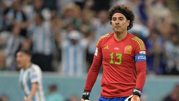 Mexico's goalkeeper #13 Guillermo Ochoa reacts during the Qatar 2022 World Cup Group C football match between Argentina and Mexico at the Lusail Stadium in Lusail, north of Doha on November 26, 2022. (Photo by JUAN MABROMATA / AFP)