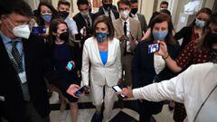 U.S. House Speaker Nancy Pelosi is surrounded by reporters and staff as she returns to her office following during negotiations on federal budget resolution legislation at the Capitol on August 23, 2021 in Washington, DC. 