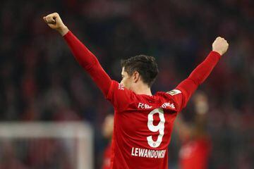 Robert Lewandowski celebrates following his team's victory in the Bundesliga match between Bayern Munich and Borussia Dortmund.