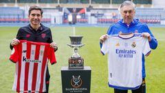 In this handout image released on January 15, 2022 by the Royal Spanish Football Federation - RFEF,  Athletic Bilbao&#039;s Spanish coach Marcelino Garcia Toral (L) and Real Madrid&#039;s Italian coach Carlo Ancelotti pose next to the Spanish Super Cup tr