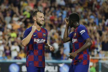 MIAMI, FLORIDA - AUGUST 07: Ivan Rakitic #4 of FC Barcelona celebrates with teammate Ousmane Dembele #11 after scoring the goal of his team against SSC Napoli during the second half of a pre-season friendly match at Hard Rock Stadium on August 07, 2019 in