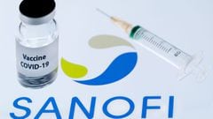 This file photo taken on November 23, 2020 shows a bottle reading &quot;Vaccine Covid-19&quot; next to French biopharmaceutical company Sanofi logo. - France&#039;s Sanofi and Britain&#039;s GSK said on December 11, 2020 their Covid-19 vaccines will not b