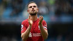 (FILES) Liverpool's English midfielder Jordan Henderson applauds fans on the pitch after the English Premier League football match between Manchester City and Liverpool at the Etihad Stadium in Manchester, north west England, on April 1, 2023. Liverpool captain Jordan Henderson has completed his move to Saudi Pro League side Al-Ettifaq, both clubs announced on Wednesday, July 27. (Photo by Paul ELLIS / AFP) / RESTRICTED TO EDITORIAL USE. No use with unauthorized audio, video, data, fixture lists, club/league logos or 'live' services. Online in-match use limited to 120 images. An additional 40 images may be used in extra time. No video emulation. Social media in-match use limited to 120 images. An additional 40 images may be used in extra time. No use in betting publications, games or single club/league/player publications. / 