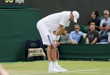 John Isner feels the strain during his five set defeat to Jo-Wilfried Tsonga