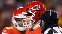 KANSAS CITY, MISSOURI - JANUARY 13: Patrick Mahomes #15 of the Kansas City Chiefs heads to the sideline after his helmet was cracked during the third quarter in the AFC Wild Card Playoffs against the Miami Dolphins at GEHA Field at Arrowhead Stadium on January 13, 2024 in Kansas City, Missouri.   David Eulitt/Getty Images/AFP (Photo by David Eulitt / GETTY IMAGES NORTH AMERICA / Getty Images via AFP)