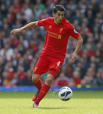File picture shows Liverpool's Nuri Sahin as he runs with the ball during their English Premier League soccer match against Stoke City at Anfield in Liverpool, northern England, October 7, 2012. Sahin is to return from Liverpool to Borussia Dortmund socce