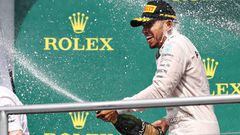  Lewis Hamilton celebrates his win on the podium in Hockenheim.