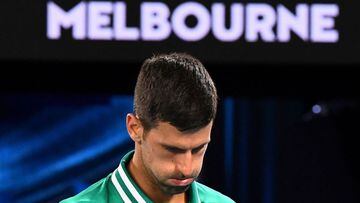 Novak Djokovic reacts while playing Taylor Fritz of the US during their men&#039;s singles match on day five of the 2021 Australian Open tennis tournament in Melbourne