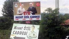 A billboard, serving as a street sign, with a picture of Arsenal&#039;s soccer player Mesut Ozil in the German national team kit is replaced by a picture of him with Turkish President Tayyip Erdogan in the Black Sea town of Devrek in Zonguldak, Turkey Jul