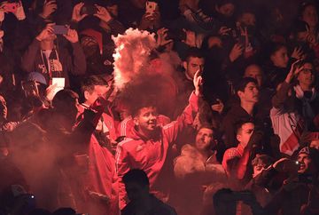 Fans of River Plate cheer before the start of the all-Argentine Copa Libertadores semi-final first leg football match against Boca Juniors at the Monumental stadium in Buenos Aires, on October 1, 2019. 