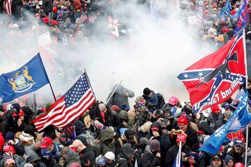 Tear gas is released into a crowd of protesters during clashes with Capitol police at a rally to contest the certification of the 2020 US presidential election results by the US Congress, at the Capitol Building in Washington, January 6, 2021. 