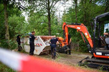 Police forces prepare a container full of waste from the allotment garden of Christian Brueckner on 29 July 2020 in Hanover, Germany.
