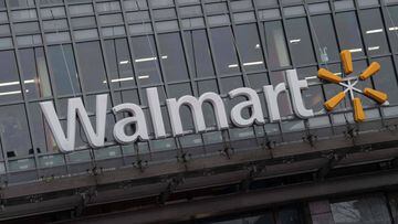 (FILES) In this file photo the Walmart logo is seen on a store in Washington, DC, on March 1, 2019. - Walmart reported increased first-quarter profits on May 19, 2020 following a surge in e-commerce sales for groceries and essential items from consumers s