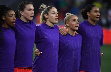 Canada players wear "enough is enough" shirts during the national anthem before the match against Brazil in the SheBelieves Cup.