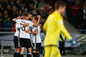 Khedira (third left) celebrates with his Germany team-mates after scoring his team's second against Northern Ireland.