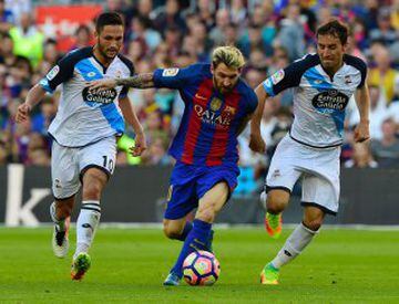 Barcelona's Argentinian forward Lionel Messi (C) vies with Deportivo's Romanian forward Florin Andone (L) and Deportivo's midfielder Pedro Mosquera Parada during the Spanish league football match FC Barcelona vs RC Deportivo de la Coruna at the Camp Nou s