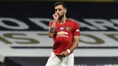 FILE - In this Friday, June 19, 2020 file photo, Manchester United&#039;s Bruno Fernandes reacts after scoring a penalty during their English Premier League soccer match against Tottenham Hotspur at Tottenham Hotspur Stadium in London, England. Ole Gunnar
