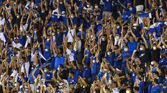 Fans of El Salvador cheer for their team during their Qatar 2020 FIFA World Cup Concacaf qualifier football match against Mexico at Cuscatlan Stadium, in San Salvador, on October 13, 2021. (Photo by MARVIN RECINOS / AFP)