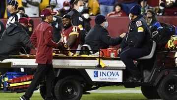 Nov 29, 2021; Landover, Maryland, USA; Washington Football Team running back J.D. McKissic (41) is taken off the field on a cart after suffering an apparent injury against the Seattle Seahawks during the second half at FedExField. Mandatory Credit: Brad M
