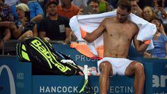 Rafael Nadal of Spain changes his shirt at the end of first set against Alexandr Dlgopolov of Ukraine in the men&#039;s round one at the Brisbane International tennis tournament in Brisbane on January 3, 2017. / AFP PHOTO / SAEED KHAN / IMAGE STRICTLY RES