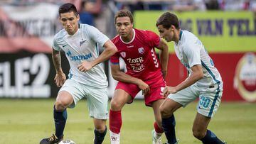 FK Zenit&#039;s Argentine midfielder Matias Kranevitter (L) and defender Emanuel Mamana (R) vie for the ball with FC Utrecht&#039;s Belgian forward Cyriel Dessers during the UEFA Europa League last qualifying round match between FC Utrecht and St Petersbu