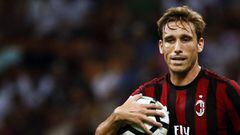AC Milan&#039;s midfielder Lucas Biglia from Argentina holds the ball during the Italian Serie A football match AC Milan Vs Cagliari on August 27, 2017 at the &#039;Giuseppe Meazza&#039; Stadium in Milan.  / AFP PHOTO / Marco BERTORELLO        (Photo credit should read MARCO BERTORELLO/AFP/Getty Images)