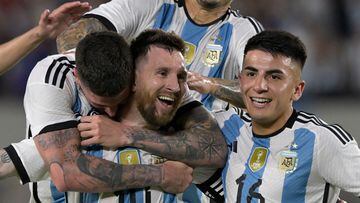 Argentina's forward Lionel Messi (C) celebrates with Argentina's midfielder Rodrigo De Paul (L) and Argentina's midfielder Thiago Almada after scoring a goal during the friendly football match between Argentina and Panama at the Monumental stadium in Buenos Aires, on March 23, 2023. (Photo by JUAN MABROMATA / AFP)
