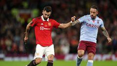 MANCHESTER, ENGLAND - NOVEMBER 10: Bruno Fernandes of Manchester United and Danny Ings of Aston Villa battle for the ball during the Carabao Cup Third Round match between Manchester United and Aston Villa at Old Trafford on November 10, 2022 in Manchester, England. (Photo by Lewis Storey/Getty Images)