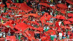 Moroccan football fans hold up national flags during the 2012 African Cup of Nations football match between Morocco and Algeria in Marrakesh on June 4, 2011. Morocco won 4-0. AFP PHOTO/ABDELHAK SENNA (Photo credit should read ABDELHAK SENNA/AFP/Getty Imag