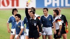 Mexican referee Ernesto Codesal Mendez gives a yellow card to Argentinian midfielder Diego Maradona (L) 08 July 1990 in Rome during the World Cup soccer final between Argentina and West Germany. The defending world champions lost 1-0 to West Germany after finishing the game with two men short. AFP PHOTO STAFF / AFP