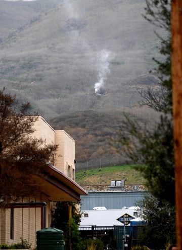 A column of smoke rises from the site of the helicopter crash that killed Kobe Bryant.