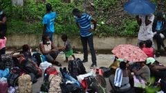 Migrants from DR Congo, Ghana and Ivory Coast, remain on the Pan-American highway after being stopped by agents of the National Police near Choluteca, south of Tegucigalpa, Honduras on June 02, 2020 amid the Covid-19 coronavirus pandemic. - The African mi