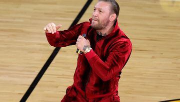 (FILES) Conor McGregor is seen on the court during a timeout in Game Four of the 2023 NBA Finals between the Denver Nuggets and the Miami Heat at Kaseya Center on June 09, 2023 in Miami, Florida. Irish mixed martial arts superstar Conor McGregor has been accused of sexually assaulting a woman at an NBA Finals in Miami last week, multiple US reports said June 15, 2023. (Photo by Megan Briggs / GETTY IMAGES NORTH AMERICA / AFP)