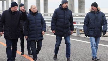 Russian President Vladimir Putin listens to Deputy Prime Minister Marat Khusnullin as he visits a bridge connecting the Russian mainland with the Crimean Peninsula across the Kerch Strait, December 5, 2022. Sputnik/Mikhail Metzel/Pool via REUTERS ATTENTION EDITORS - THIS IMAGE WAS PROVIDED BY A THIRD PARTY.