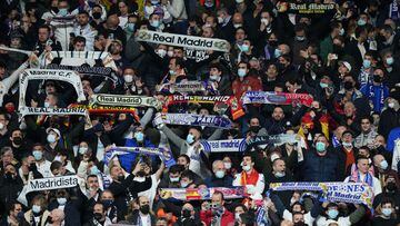 MADRID, SPAIN - MARCH 09: Fans of Real Madrid look on from the stands during the UEFA Champions League Round Of Sixteen Leg Two match between Real Madrid and Paris Saint-Germain at Estadio Santiago Bernabeu on March 09, 2022 in Madrid, Spain. (Photo by An